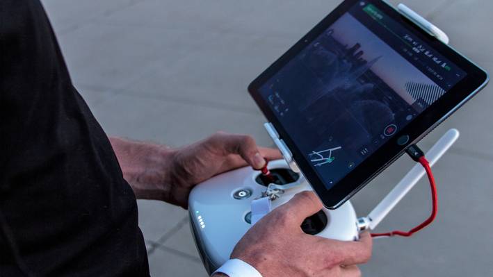 Internet of Things ICT Close-up of a tablet with attached dronw